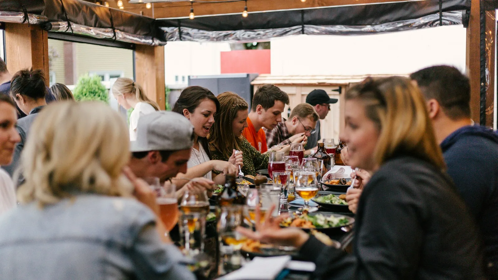 Friends sharing party food around a table